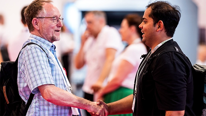 Textiles Manufacturing Expo handshake